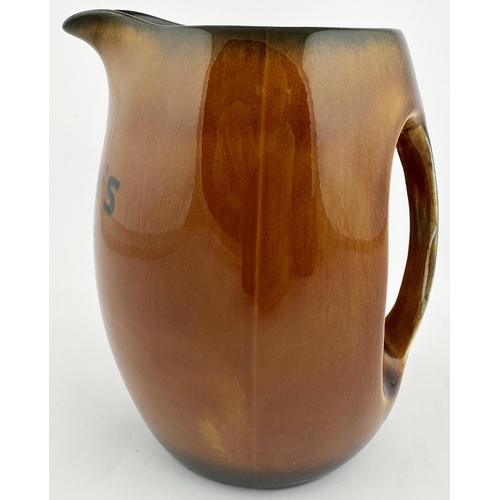 63 - CAMERONS SPARKLING ALES JUG. 5.9ins tall. Dark brown rim and bottom, lighter brown central glaze. Bl... 