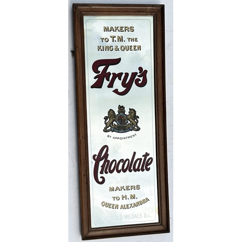 254 - FRYS CHOCOLATE MIRROR. 30.1 x 11.9ins. Attractive wooden framed tall mirror, coat of arms to centre,... 