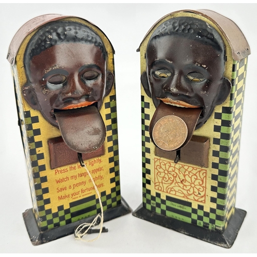 82 - BLACK PERSON HEAD TINPLATE MONEY BOX. 7.1ins tall. Multi coloured lithographed curved top money box,... 