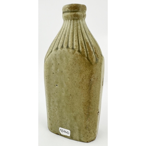 136 - EDWINSTOWE SLAB SEALED FLASK. 7.1ins tall. Small rectangular bodied, ribbed neck, grey green slip gl... 