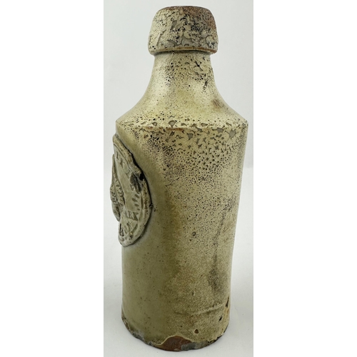 138 - ACCRINGTON SLAB SEALED GINGER BEER. 7ins tall. Very crude hand thrown stoneware ginger beer shape, b... 