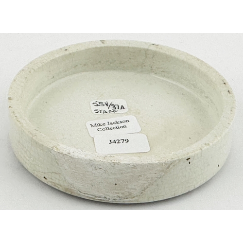 152 - UTTOXETER POT LID. (APL 581, 37a) 2.9ins diam. Larger size lid with black transfer with coiled ribbo... 