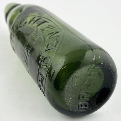 17 - J W BRIGHT RUSHDEN GREEN GLASS CODD BOTTLE. 9.1ins tall. Dark green 10oz standard codd heavily embos... 