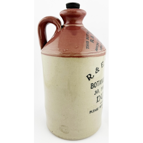 23 - DUNDEE PINK TOPPED FLAGON. 11.2ins tall, strong pink top section, rear handle. T.t with stopper. R. ... 