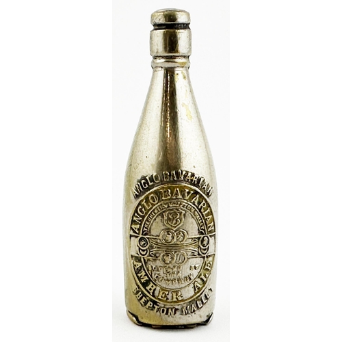 27 - PLATED BRASS BOTTLE-SHAPED MATCH SAFE ADVERTISING BOTTLE. 2.7ins tall. Heavily embossed across front... 