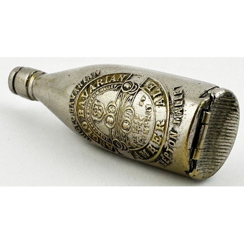 27 - PLATED BRASS BOTTLE-SHAPED MATCH SAFE ADVERTISING BOTTLE. 2.7ins tall. Heavily embossed across front... 