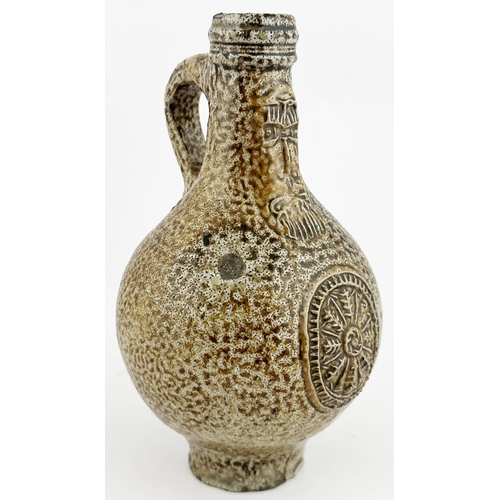 6 - ENGLISH BELLARMINE. 8.5ins tall. A very impressive classic c.1650 period jug featuring delightful va... 