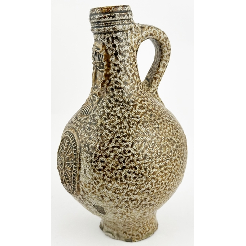 6 - ENGLISH BELLARMINE. 8.5ins tall. A very impressive classic c.1650 period jug featuring delightful va... 