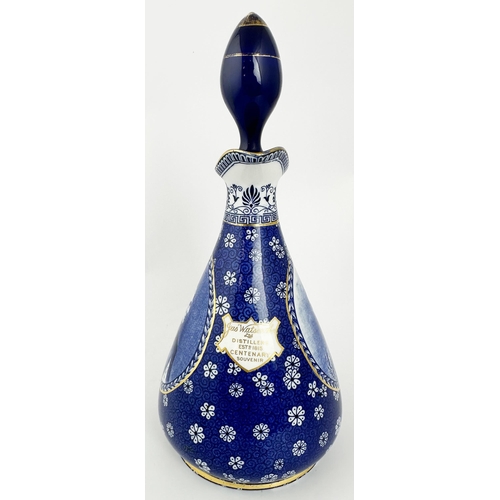 98 - JAS WATSON CENTENARY WHISKY JUG DECANTER. 10.7ins tall to top of lozenge shape stopper. Attractive b... 