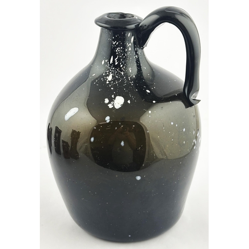 163 - NAILSEA GLOBULAR HANDLED JUG. 8.9ins tall. Familiar black, very dark green, glass with additional wh... 