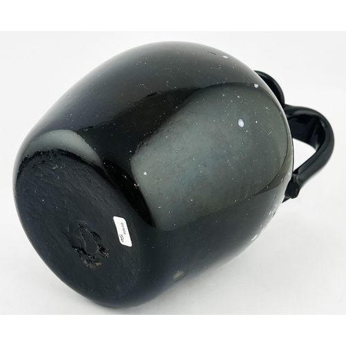 163 - NAILSEA GLOBULAR HANDLED JUG. 8.9ins tall. Familiar black, very dark green, glass with additional wh... 