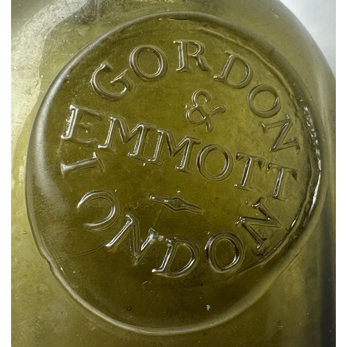 168 - LONDON SEALED UTILITY BOTTLE. 4.5ins tall. Very dark olive gree glass. Rectangular form with canted/... 