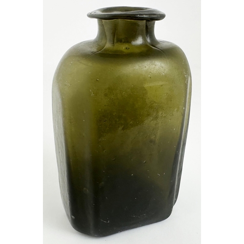 168 - LONDON SEALED UTILITY BOTTLE. 4.5ins tall. Very dark olive gree glass. Rectangular form with canted/... 