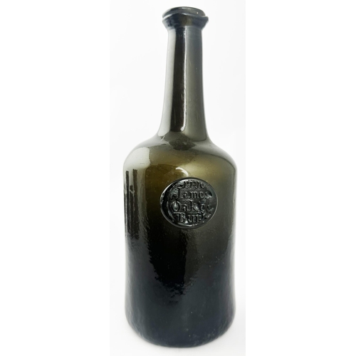 174 - JAMES OAKES BURY 1770 DATED ENGLISH CYLINDER WINE BOTTLE. (Burton p766-767). 10.3ins tall. Something... 