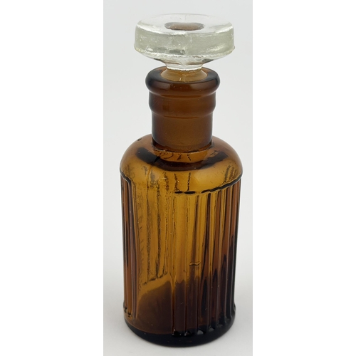 1 - BAILEY POISON BOTTLE. 3.3ins tall. (DP p67). Brown glass cylinder, sturdy flat topped clear glass gr... 