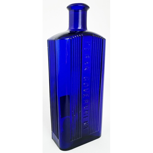 23 - PERAK GOVERNMENT RECTANGULAR POISON BOTTLE. 7.25ins tall. (DP p114) Cobalt blue, rectangular, emboss... 