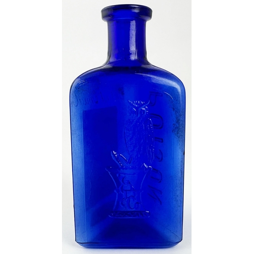 40 - THE OWL DRUG CO POISON BOTTLE. 5ins tall. Cobalt blue glass, triangular shape, embossed to all three... 