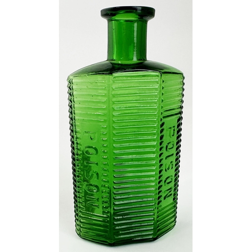 44 - POISON BOTTLE. 5.5ins tall. Bright green glass, hexagonal type shape with horizontal lines & two pan... 