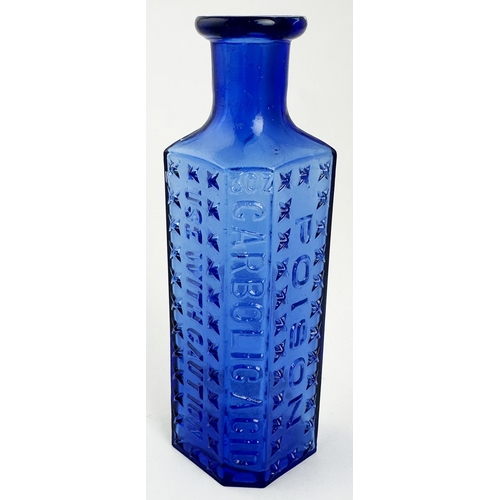 47 - AMERICAN CARBOLIC ACID POISON BOTTLE. 5ins tall. Cobalt blue, heavily embossed with lettering & cros... 