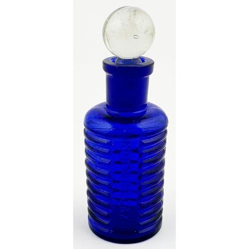 5 - BAILEY POISON BOTTLE. 3.4ins tall. (DP p67) Cobalt blue cylinder, clear glass spherical stopper. Hor... 