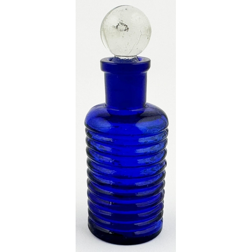 5 - BAILEY POISON BOTTLE. 3.4ins tall. (DP p67) Cobalt blue cylinder, clear glass spherical stopper. Hor... 