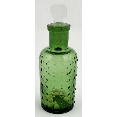 3 - BAILEY POISON BOTTLE. 3.7ins tall. (DP p67) Green glass cylinder, slim chisel stopper. Sparsely cove... 