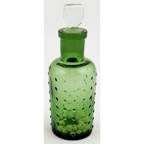 3 - BAILEY POISON BOTTLE. 3.7ins tall. (DP p67) Green glass cylinder, slim chisel stopper. Sparsely cove... 