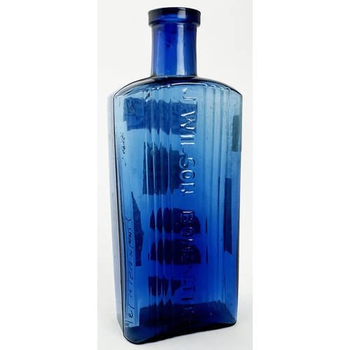 45 - J WILSON BONESETTER POISON BOTTLE. 5.25ins tall. Cobalt blue, vertical ribbing, embossed to centre J... 