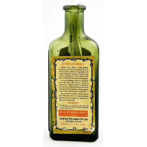 63 - SYDNEY EMERALD OIL BOTTLE. 5ins tall. Olive green glass, paper labelled back & front. Embossed to si... 