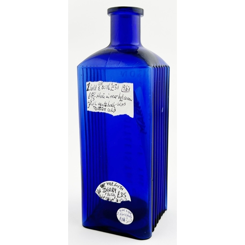 64 - SHEFFIELD CORPORATION POISON BOTTLE. (DP p120) 6.5ins tall. Cobalt blue, square bodied, embossing to... 