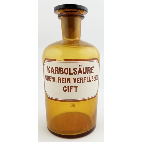 68 - SHOP CHEMIST ROUND. 8.5ins tall. Amber glass, enamelled label to front KARBOLSAURE/ GHEM REIN VERFLU... 