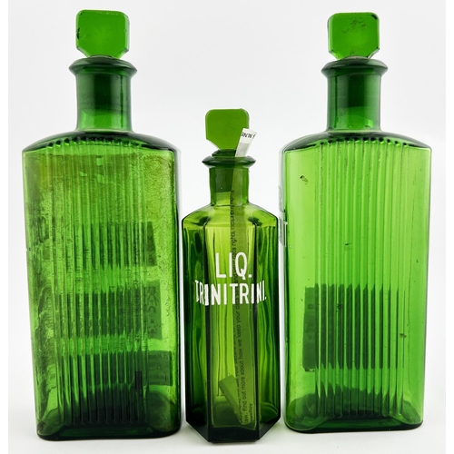 82 - CHEMIST BOTTLE TRIO. Tallest 6.75ins. Two rectangular, one hexagon shape with stoppers. Enamelled le... 