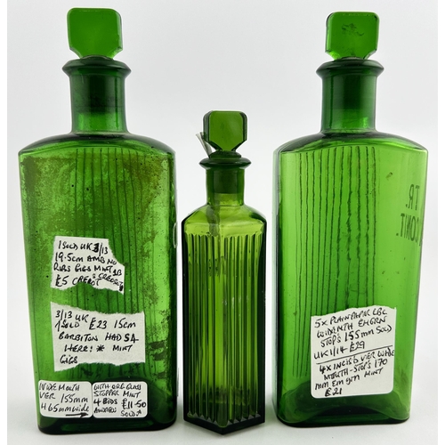 82 - CHEMIST BOTTLE TRIO. Tallest 6.75ins. Two rectangular, one hexagon shape with stoppers. Enamelled le... 