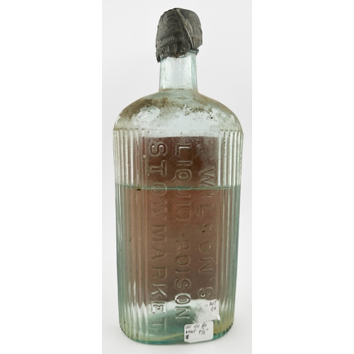 87 - STOWMARKET LIQUID POISON BOTTLE. 9.5ins tall. Clear glass bottle with paper label, embossing to rear... 