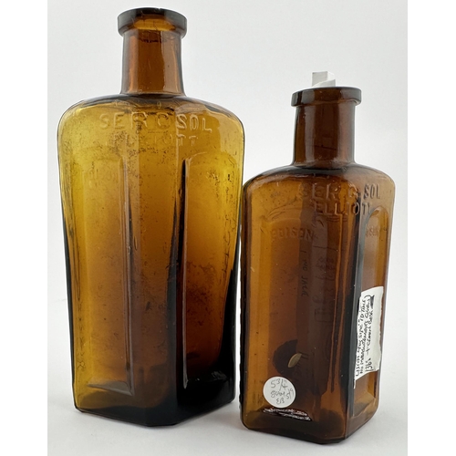 90 - SYDNEY POISON BOTTLE DUO. Tallest 6.3ins. Amber glass, flat back, embossing SERCSOL/ ELLIOTT/ POISON... 