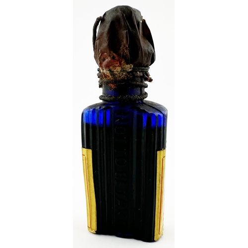 91 - LIVERPOOL & LONDON LABELLED POISON BOTTLE. 3.25ins tall. Cobalt blue rectangular bottle, embossed to... 