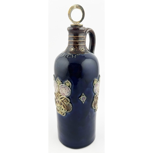 433 - DOULTON LAMBETH SCOTCH WHISKY DECANTER. 10.5ins tall. Blue shiny glaze with green/ brown leaf type s... 