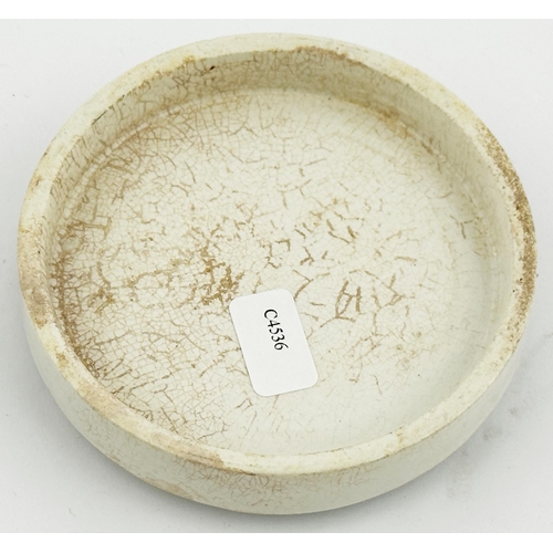 464 - LONDON POT LID. (APL p351, 59) 3ins diam. Green transfer with a floral design, boat to centre. This ... 