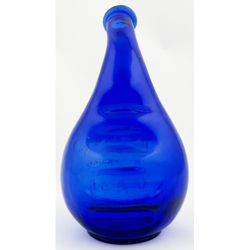 31 - CREMEX SHAMPOOING VASE. 7.5ins tall. Cobalt blue, embossed. Slight roughness to lip.