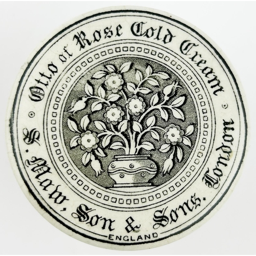 427 - OTTO OF ROSE COLD CREAM LID & BASE. 2.5ins diam. Vase of flowers to centre.