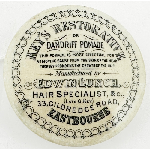 18 - EASTBOURNE POT LID. (APL pg596,75a) 3ins diam. Black transfer with oyster style border around severa... 