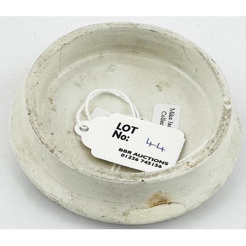 44 - EDINBURGH POT LID. (APL pg541,54) 3.25ins diam. Domed shape lid, black transfer with coiled ribbon b... 