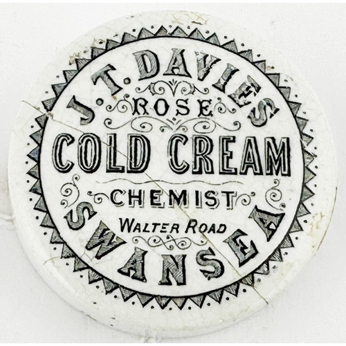 51 - SWANSEA POT LID. (APL pg623,43) 2.5ins diam. Bold black transfer with decorative border. J.TDAVIES/ ... 