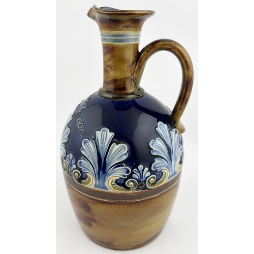 563 - GRANT MACKAY & CO SCOTCH WHISKY JUG. 9ins tall. Blues & brown floral decoration, applied lettering a... 