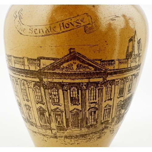 570 - THE SENATE HOUSE CAMBRIDGE WHISKY JUG. WG p167. 7.5ins tall. Tan top, sepia print of The House to fr... 