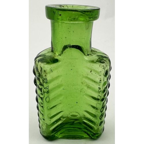 575 - FOULSTONS CRESCENT POISON. (DP p57). 2.2ins tall (2D size). Bright emerald green glass. Familiar her... 