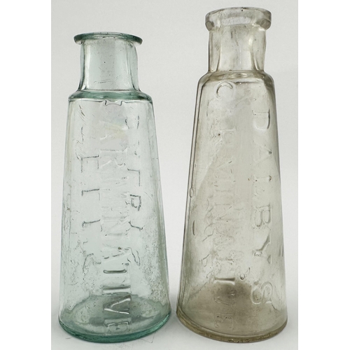 594 - DALBYS GELLS & CARMINATIVE BOTTLE DUO. Tallest 4.1ins tall. Smaller example aqua embossed very bodly... 