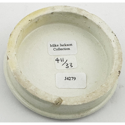 601 - LONDON POT LID. (APL p411, 33) 2.7ins diam. Black transfer with rose border & vines wrapping the let... 