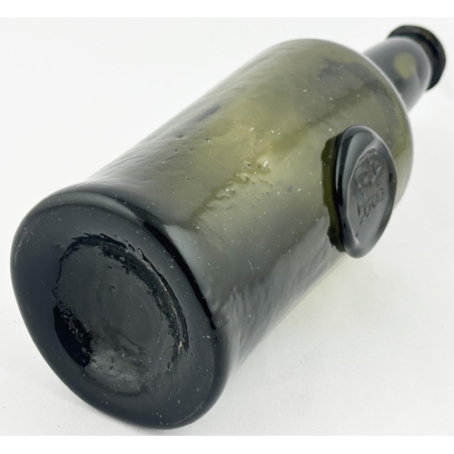 639 - CYLINDER WINE BOTTLE. 11ins tall. (Burton p1036) c1794-1800. Black/ dark olive glass. Long neck, dou... 