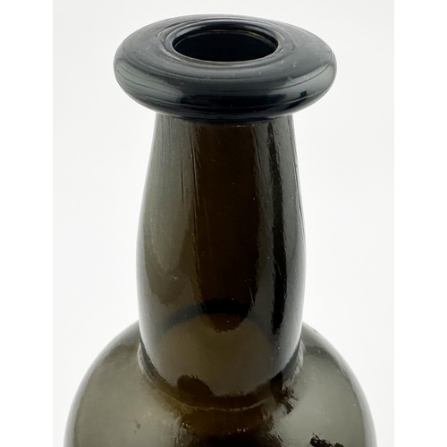 641 - SEALED WINE BOTTLE. 9.5ins tall. (Burton p1426) c.1860s. Black/ light brown glass. Shorter neck comp... 